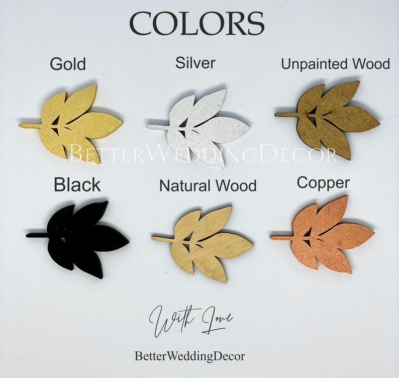 May include: A color chart displaying six leaf-shaped cutouts labeled Gold, Silver, Unpainted Wood, Black, Natural Wood, and Copper. The text BETTERWEDDINGDECOR and With Love BetterWeddingDecor are visible. Each leaf features a central stem and cutouts.