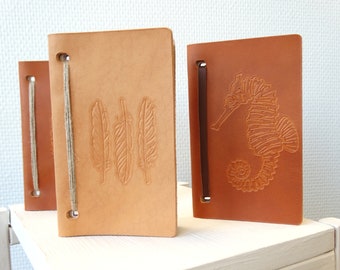 Small leather notebook with customizable pattern