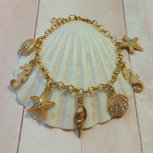 Gold Plated Sea Charm Bracelet: Peach Seashells, Starfish