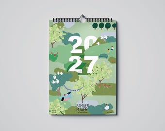 May include: A wall calendar for 2027 with a spiral binding. The cover features a green landscape illustration with trees, mushrooms, and small figures relaxing outdoors. The text 2027 is printed in large white font, with FAMILIEN PLANER at the bottom.