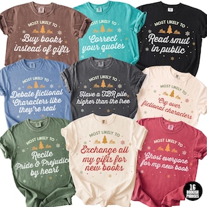 May include: A collection of t-shirts in various colors, each featuring the phrase "MOST LIKELY TO" above a Christmas tree graphic and a bookish quote. Quotes include "Buy books instead of gifts" and "Read smut in public."