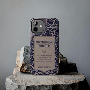 May include: A beige and blue phone case with a floral design and the text "Wuthering Heights" and a quote from the book by Emily Bront&euml;.