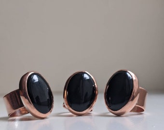 Weelderige koperen statementring met ovale onyx-edelsteen