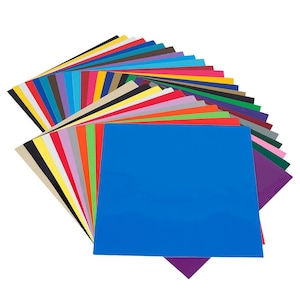 Puede incluir: Un abanico de 25 hojas de vinilo de colores, cada hoja es de un color diferente. Las hojas est&aacute;n dispuestas en forma de arco&iacute;ris, con los colores que van del rojo al morado.