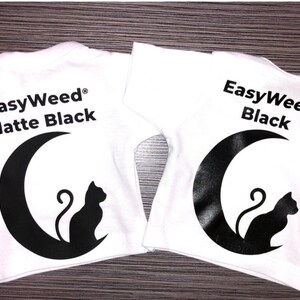 May include: Two white t-shirts with a black crescent moon and cat design. The text "EasyWeed&reg; Matte Black" is on one shirt and "EasyWeed&reg; Black" is on the other.