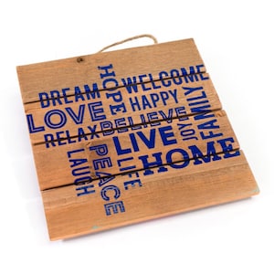 May include: Wooden sign with the words "Dream", "Love", "Relax", "Laugh", "Peace", "Life", "Hope", "Welcome", "Happy", "Believe", "Live", "Joy", "Family", and "Home" printed in blue.