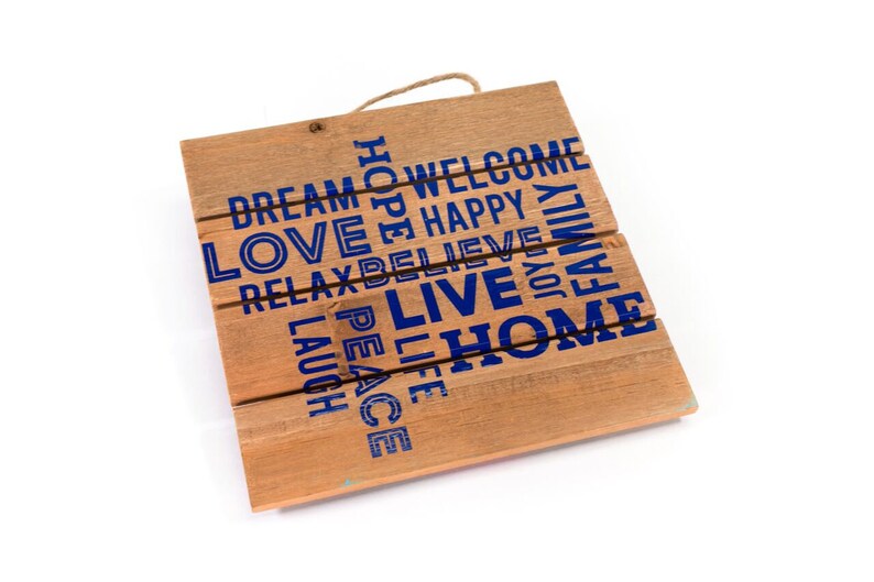 May include: Wooden sign with the words "Dream", "Love", "Relax", "Laugh", "Peace", "Life", "Hope", "Welcome", "Happy", "Believe", "Live", "Joy", "Family", and "Home" printed in blue.