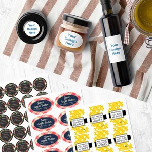 May include: A set of labels for jars and bottles. The labels are printed with a variety of designs, including floral patterns, gingham patterns, and honeycomb patterns. The labels are also printed with text, such as "June's Apple Butter" and "Miss Maisie's 100% Pure Honey".