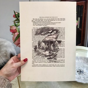 May include: A black and white illustration of a hand holding a small, silver ring. The text "The Fellowship of the Ring" is printed at the top of the page. The text "But why not destroy it, as you say should have been done long ago?" is printed below the illustration.