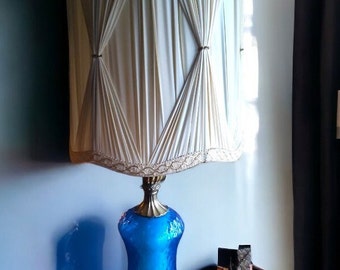 VINTAGE elegance meets Mid Century charm in a blue glass lamp Iconic Mid Century Modern design Retro-chic blue glass lighting