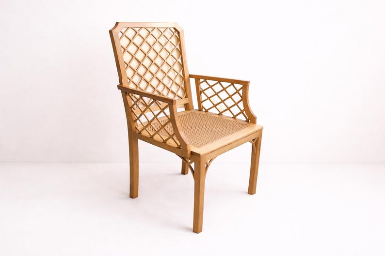 A wooden chair with a woven cane seat and a diamond-shaped lattice back. The chair is light brown and has a simple, elegant design.
