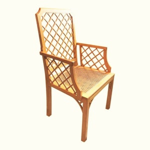 May include: A wooden chair with a lattice back and seat. The chair has a light brown finish and is made of solid wood.