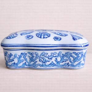 VINTAGE Asian ceramic box showcasing shells in traditional blue white Intricately designed blue white porcelain lidded box with shell theme