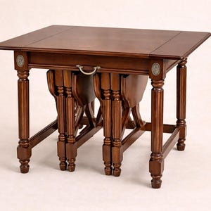 May include: A set of three ceramic mugs with a speckled, matte finish. The mugs are in shades of cream, light gray, and dark gray. Each mug has a simple, minimalist design, perfect for coffee or tea.