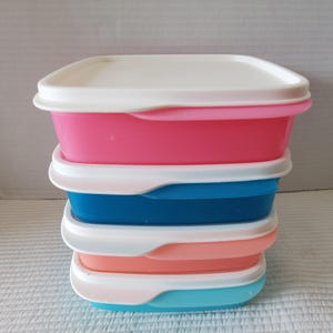 May include: A white ceramic mug with a black handle and the text "But First, Coffee" in a black, bold font. The mug is on a white surface. The mug is approximately 4 inches tall.