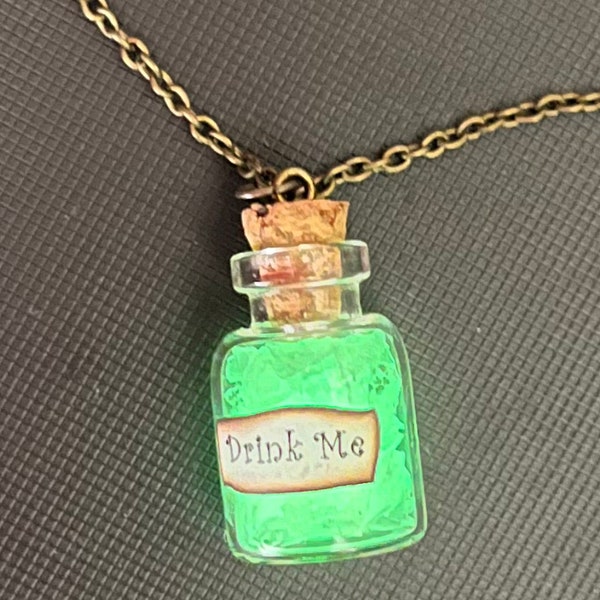 Alice in Wonderland glow in the dark pendant necklace. Drink Me