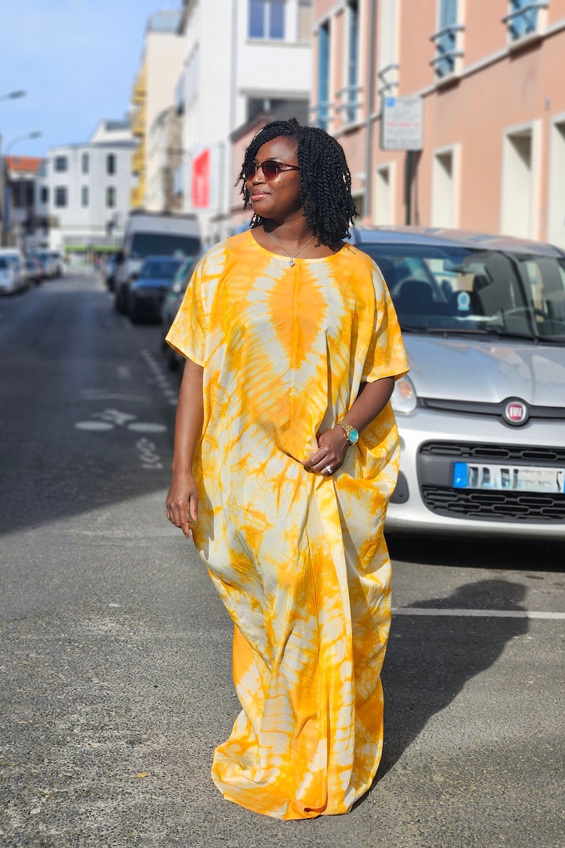 African Silky Adire dress with head tie. Yellow bubu long dress. Kaftan dress image 2