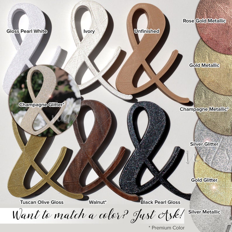 May include: A variety of ampersand signs in different colors and finishes, including gloss pearl white, ivory, unfinished, rose gold metallic, gold metallic, champagne glitter, champagne metallic, silver glitter, gold glitter, Tuscan olive gloss, walnut, black pearl gloss, and silver metallic. The text "Want to match a color? Just Ask!" is at the bottom of the image.