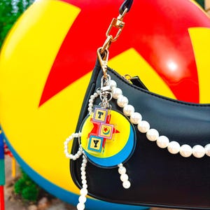 Slink’s Ball Bag Charm | Double-Sided 2-Piece Acrylic Keychain | Theme Park Inspired Accessory | Backpack, Purse, Fanny Pack, Pouchette