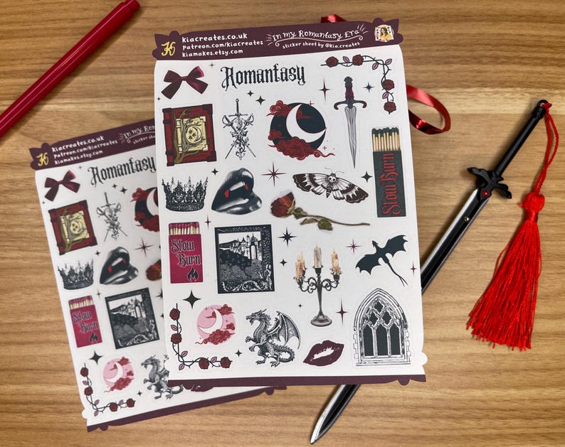 May include: Two sheets of stickers featuring a romantic fantasy theme. The stickers are printed on white paper with a black background. The stickers feature a variety of images, including a castle, a dragon, a sword, a butterfly, a rose, and a heart. The text "Romantasty" is printed on the stickers.