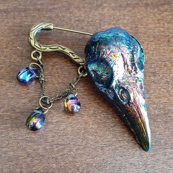 Broche "Holobird" - broche bronze avec tête d'oiseau en résine holographique, gouttes aux couleurs changeantes, mystérieux et fascinant