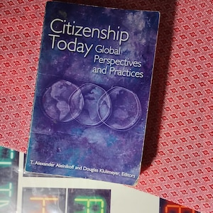 May include: A book titled "Citizenship Today: Global Perspectives and Practices" with a blue and purple cover. The cover features three overlapping globe illustrations and the names of the editors, T. Alexander Aleinikoff and Douglas Klusmeyer.