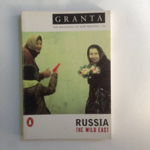 May include: A magazine cover featuring a photo of three people in Russia. The magazine is titled "Granta: The Magazine of New Writing" and the subtitle is "Russia: The Wild East".