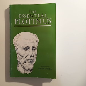 May include: A green book with the title "THE ESSENTIAL PLOTINUS" in white text. A black and white illustration of a man's face is on the cover. The text "translation by ELMER O'BRIEN" is at the bottom of the cover.