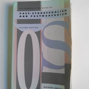May include: A book titled "An Introductory Guide to Post-Structuralism and Postmodernism" by Madan Sarup. The book cover features a large, colorful "OS" design.