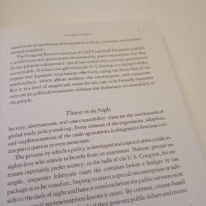 May include: A page from a book titled "Thieves in the Night" by Ralph Nader. The text discusses the secrecy and unaccountability of global trade policy-making. The text highlights how trade agreements are designed to exclude citizen participation and awareness.