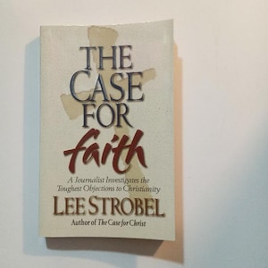 May include: A book titled "The Case for Faith" by Lee Strobel, author of "The Case for Christ". The book cover features a cross and the title in a bold, red font.