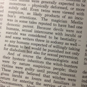 May include: A page from a book with black text on white paper. The text discusses the history of demons and how they were viewed in the past. The text mentions that twins were often viewed with suspicion as being the product of demons.