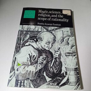 May include: A book titled "Magic, science, religion, and the scope of rationality" by Stanley Jeyaraja Tambiah. The cover features a black and white illustration of a man in a robe, possibly a monk, with scientific equipment.