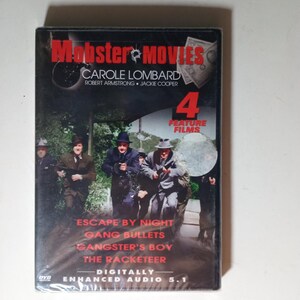 May include: A DVD case for "Mobster Movies" featuring Carole Lombard, Robert Armstrong, and Jackie Cooper. The cover displays a group of men in suits and hats, with the titles of four feature films: "Escape by Night," "Gang Bullets," "Gangster's Boy," and "The Racketeer."