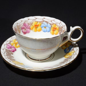 Vintage Delphine Teacup & Saucer Bone China Pink Yellow Blue Flower Gold Rimmed Floral Footed Made in England swag brown 5173