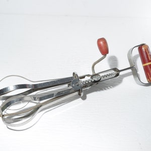 Vintage hand beater Ekco red wood handle metal egg beater speed beater stainless steel kitchen gadgets cooking utensils USA
