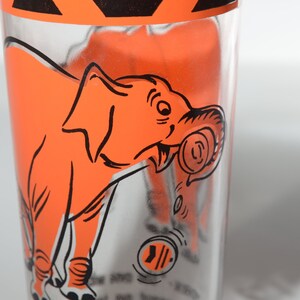 Vintage Skippy Drinking glass orange Elephant The one with the peanut on top Highball glass Tumbler glass 4.75&quot; tall rare promotional