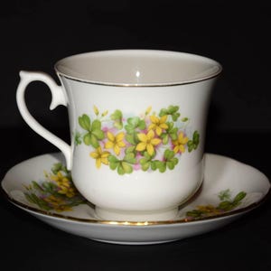 QUEEN ANNE Bone China tea cup and saucer pattern featuring green (clover) and yellow flowers Gold Rimmed England Vintage floral teacup