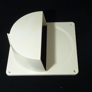 May include: A square, off-white plastic exterior wall vent cover featuring a semi-circular hood that extends over a circular opening. The flat base plate includes four small screw holes, one located at each corner, designed for mounting to a flat surface.