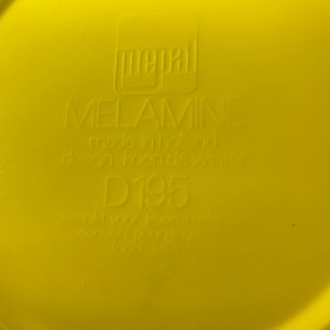May include: Yellow melamine plate with the text "pepal MELAMINE made in holland design: koen de winter D195" printed on the bottom.