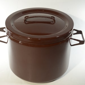 May include: A brown enamel pot with a lid and two handles. The pot is made of metal and has a smooth, glossy finish.