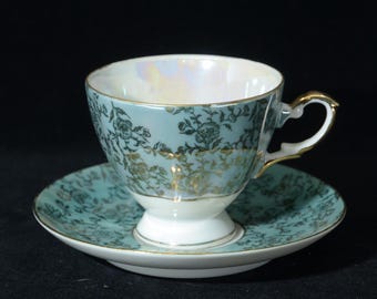 Ford China Iridescent Hand Painted Japan Floral pattern on Teal Blue Teacup and Saucer Set A-906 Lusterware loss of paint chintz