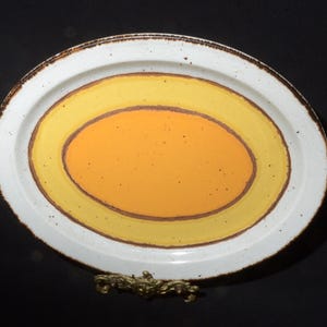 Stonehenge Midwinter Sun England serving plate serving dish platter orange yellow pottery 1970s farmhouse decor hard to find light CRAZING