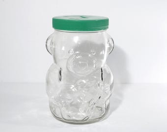 Vintage Bear Glass Peanut Butter Bank Jar Green plastic lid 1980s 7.5"tall Kraft Collectible cookie jar jar with slit still bank clear glass