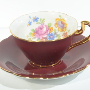 VANDERWOOD Teacup and Saucer Burgundy red gold Genuine Bone China England floral bouquet to the inside gold handle  teatime