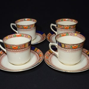 J&G Meakin Sol Queen Mary set of 4 teacup and saucer band England ironstone 391413 gold cobalt rim rust yellow flowers