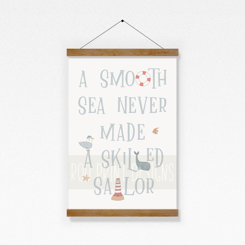 May include: A light blue and white printable wall art print with the quote "A smooth sea never made a skilled sailor". The quote is surrounded by nautical themed illustrations including a life preserver, a fish, a seagull, a whale, a lighthouse, and a starfish.