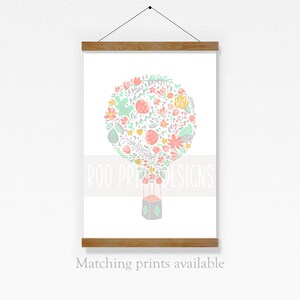 May include: A pastel pink, green, and yellow floral hot air balloon illustration with the text "Roo Prints Designs".
