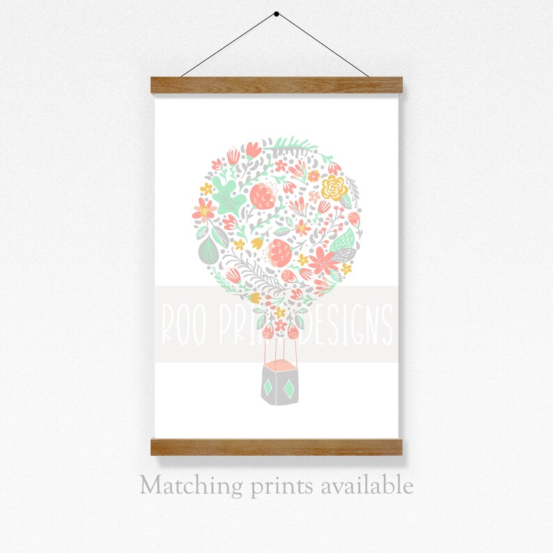 May include: A pastel pink, green, and yellow floral hot air balloon illustration with the text "Roo Prints Designs".