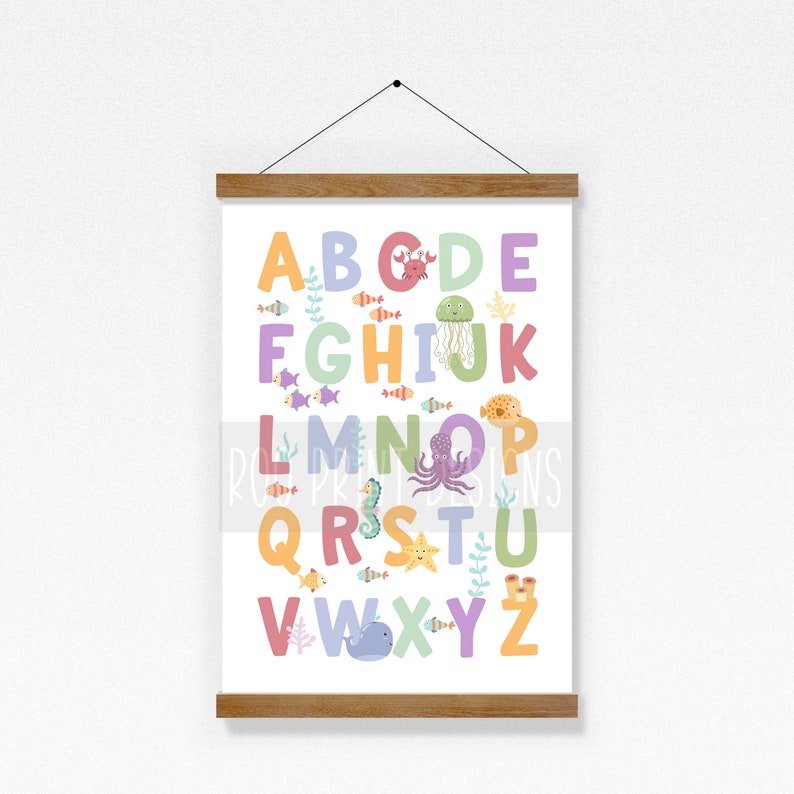 May include: A colorful alphabet poster with sea creatures. The letters are in a rainbow of colors, and each letter is paired with a different sea creature, such as a crab, jellyfish, octopus, and starfish.